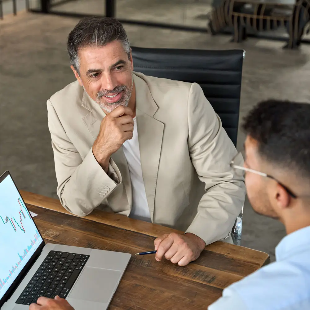 Financial planner and client discussing wealth management for business | Planico